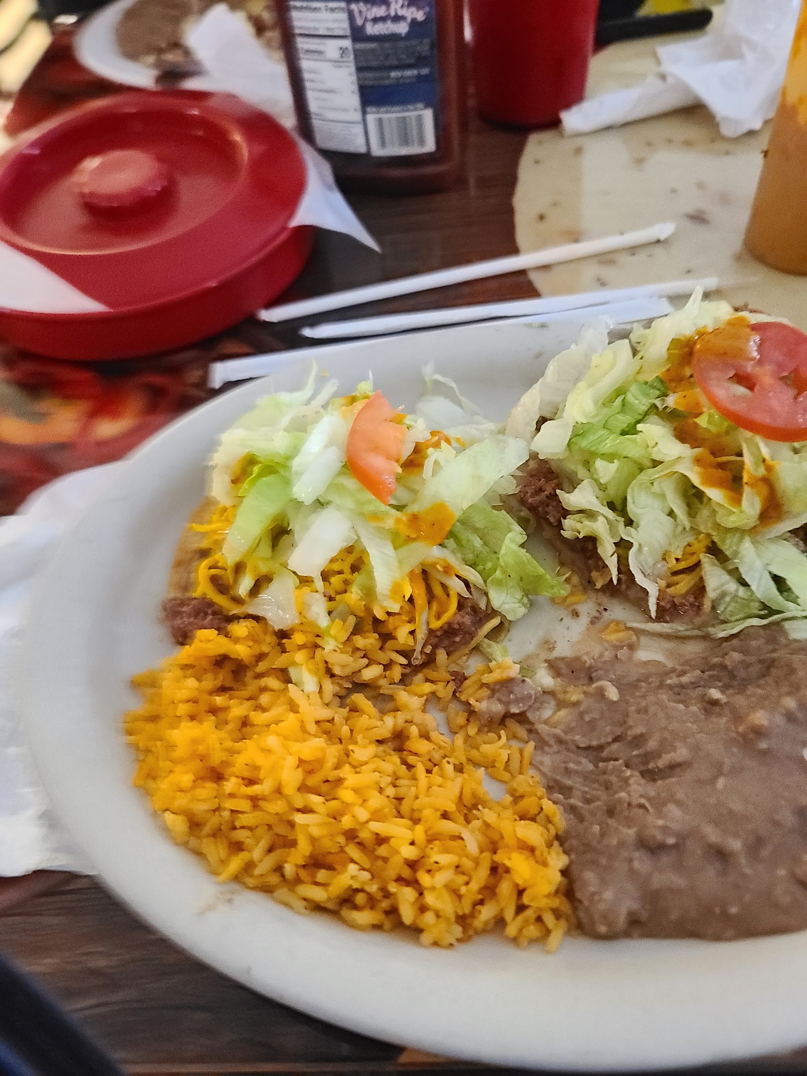 Crispy beef tacos plate with Mexican rice and refried beans